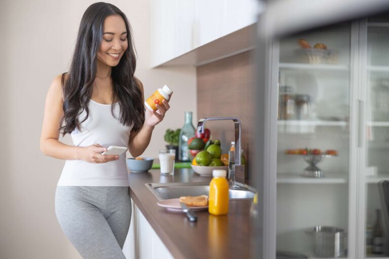 lady with vitamin tablets